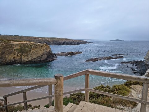 Stairs descending down a cliff over the Atlantic ocean in Porto Covo