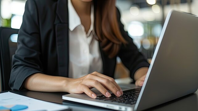 woman working with finances on laptop