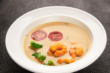 Tom kha soup shrimp, coconut milk, miso paste tasty seafood snack fresh delicious gourmet food background on the table rustic food top view copy space pescetarian diet