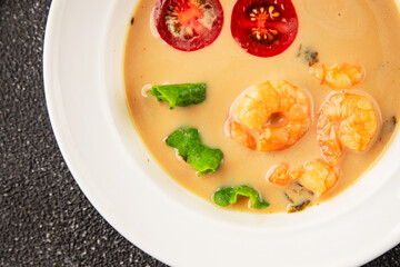Tom kha soup shrimp, coconut milk, miso paste tasty seafood snack fresh delicious gourmet food background on the table rustic food top view copy space pescetarian diet