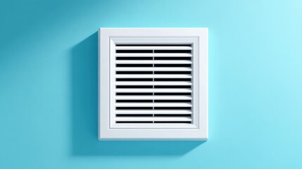 A white vent on a light blue wall, casting a subtle shadow, indicating airflow or ventilation.