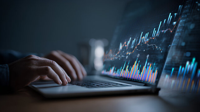 Data analytics and graphs. Analysis of statistical business marketing data. Data scientist using laptop computer to analyze data.