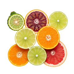 Obraz premium Assortment of fresh citrus fruit slices on a white background