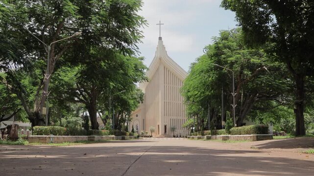 4K footage of St. Michael Archangel Church in Tha Rae, Sakon Nakhon, Thailand. Historic Catholic landmark with Gothic architecture and cultural heritage atmosphere.