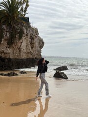 young couple walking on the beach