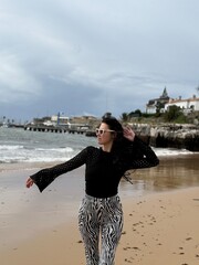 young woman walking on the beach