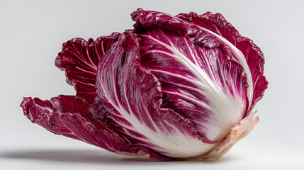 Obraz premium Radicchio head displaying vibrant red and white leaves, a fresh and visually appealing ingredient.