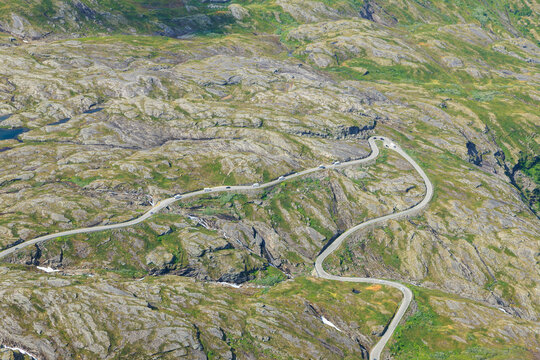 Aerial view of switchback road packed with RVs, Norway summer