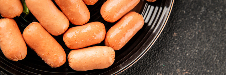 Mini sausages fresh delicious processed meat tasty snack fresh delicious gourmet food background on the table rustic food top view copy space