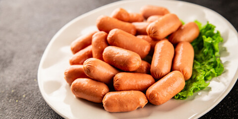 Mini sausages fresh delicious processed meat tasty snack fresh delicious gourmet food background on the table rustic food top view copy space