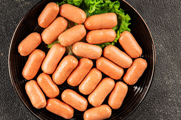 Mini sausages fresh delicious processed meat tasty snack fresh delicious gourmet food background on the table rustic food top view copy space