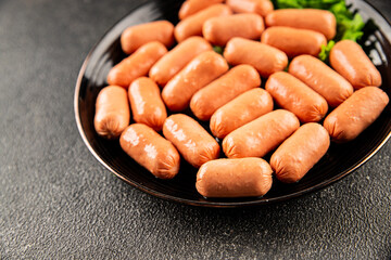 Mini sausages fresh delicious processed meat tasty snack fresh delicious gourmet food background on the table rustic food top view copy space