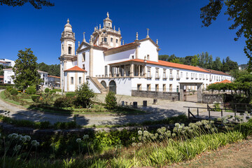 Mosteiro de Sao Miguel de Refojos illuminating Cabeceiras de Basto, Portugal, under summer sky