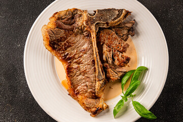 t-bone steak roast cut of meat juicy roast beef tasty snack fresh delicious gourmet food background on the table rustic food top view copy space