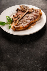 t-bone steak roast cut of meat juicy roast beef tasty snack fresh delicious gourmet food background on the table rustic food top view copy space