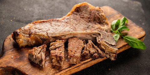 t-bone steak roast cut of meat juicy roast beef tasty snack fresh delicious gourmet food background on the table rustic food top view copy space