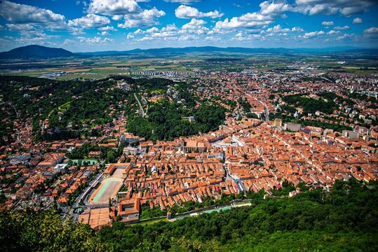 Historic Brasov with red roofs and mountains - Powered by Adobe