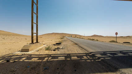 Desert Road Under Clear Blue Sky