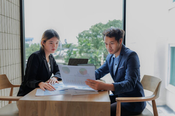 Business professionals discussing and negotiating an investment deal to reach a final agreement.