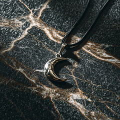 Silver Crescent Moon Pendant Necklace Jewelry Accessory Shine Glossy Dark Rock Marble Luxury Fashion Design Charm Style Closeup Elegant Decorative Circular Symbol Personalized Moonlight Gift