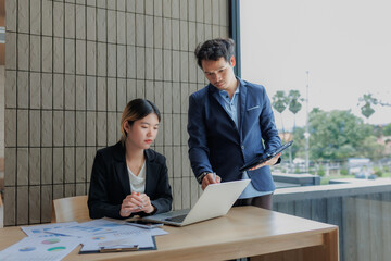 Businessmen and businesswomen collaborating to finalize investment strategies.