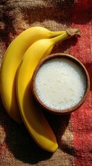 Bananas with yogurt on rustic wooden surface.