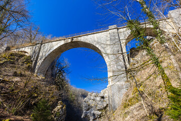 Devil's Bridge arching over the Loue River in Crouzet Migette, Doubs, France