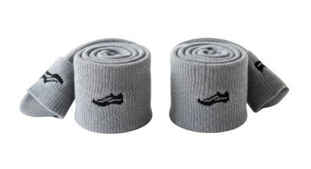 Two rolled up gray socks with black logos isolated on transparent background