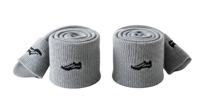 Two rolled up gray socks with black logos isolated on transparent background