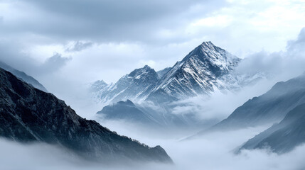 Majestic mountain peaks rise above sea of clouds, shrouded mist and mystery. snow capped summits contrast with dark rocky slopes, creating breathtaking landscape that evokes sense of wonder