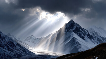 Majestic mountain landscape with dramatic lighting, showcasing snow covered peaks and rays of sunlight piercing through dark clouds. scene evokes sense of awe and tranquility