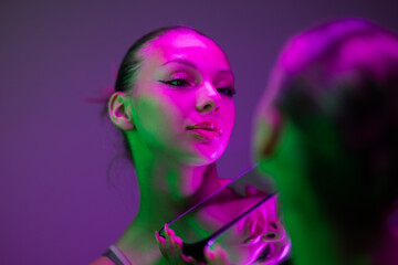 Portrait Of Woman Posing Under Neon Lights