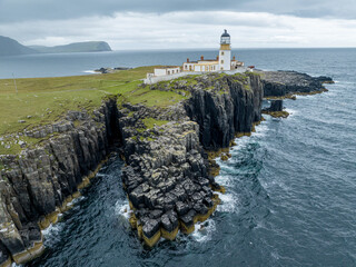 Aerial view of Neist Point, a promontory on the Isle of Skye, Scotland, famous for its lighthouse and sheer cliffs. UK