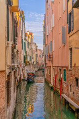 Narrow Venetian canals between historic houses