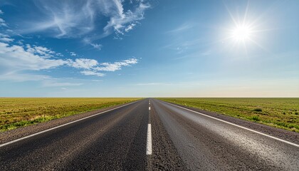 Fototapeta premium Asphalt Straight Road With Blue Sky and Sun Flare Landscape