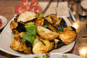 Stir-fried Potatoes, Eggplant, and Peppers. Chinese food