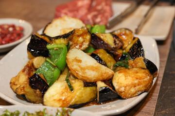 Stir-fried Potatoes, Eggplant, and Peppers. Chinese food