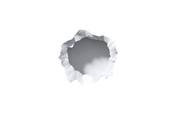 A circular hole punched through white paper, showing ragged edges