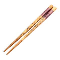 Pair of ornate wooden chopsticks with intricate floral patterns isolated on transparent background