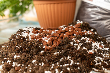 rich organic potting soil with perlite and clay pebbles, perfect for gardening, plant growth,...