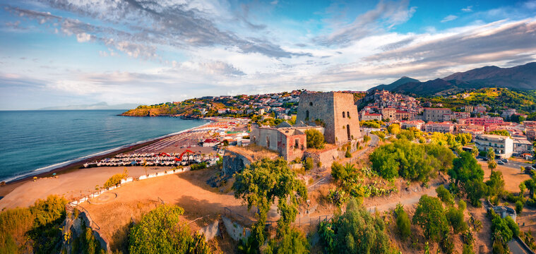 Panoramic summer view from flying drone of historical place - Talao Tower. Superb morning cityscape of Scalea town, Province of Cosenza, Italy. Vacation concept background.