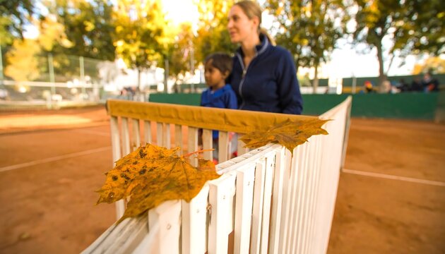 Autumnal tennis scene with a mother and child - Powered by Adobe