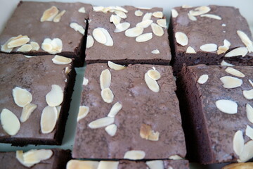 Chocolate brownie is tempting with almond slices and taste is satisfying, fresh and delicious