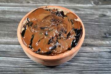 Sandwich cookie creamy with cake, topped with chocolate paste and layered with cake, a soft...