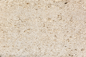 Close-up grey brick wall texture. House stone wall texture background. Stone wall as background or texture. Part of a stone wall.  Ideal for backgrounds, textures, and construction-related