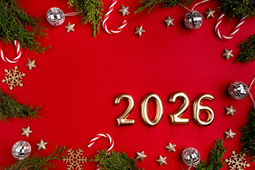 Christmas and Happy New year 2026 with gold glitter decorations on red bright background. Holiday...