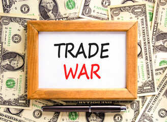 Trade war symbol. Concept word Trade war on beautiful wooden picture frame. Dollar bills. Beautiful...