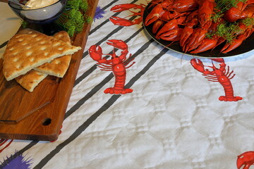 Signal crayfish party. Feast at dinner with crawfish party. Matching table cloth. Sweden 2025.