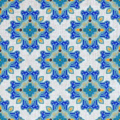 Seamless Floral Pattern in Blue and Orange on Textured Fabric