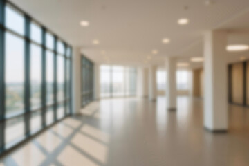 Fototapeta premium blurred for background. office building interior, empty hall in the modern office building. empty open space office. panoramic windows and beautiful lighting. Corporate Workspace, Business Interior